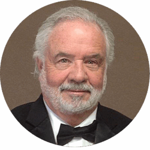 Bearded man in tuxedo smiling