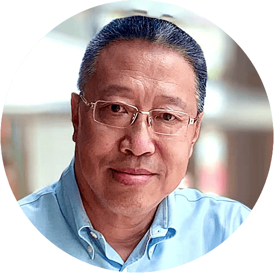 Headshot of smiling man with glasses
