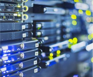 Close-up of server racks with blinking lights in a data center.