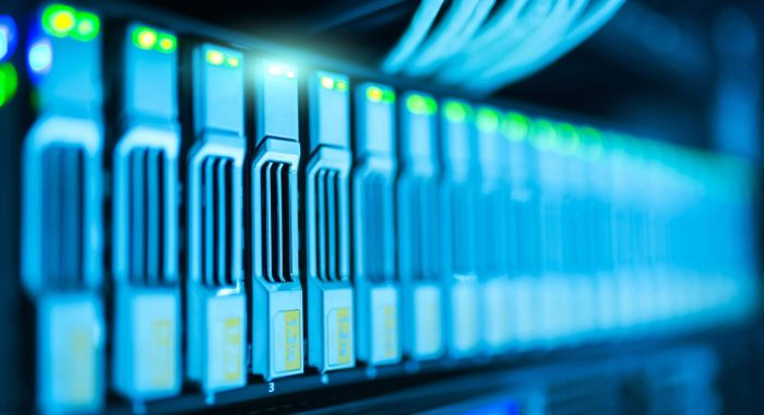 Detailed image of a server rack with glowing lights in a modern data center.