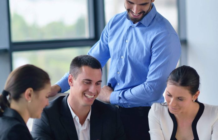 Business team reviewing tablet charts in meeting